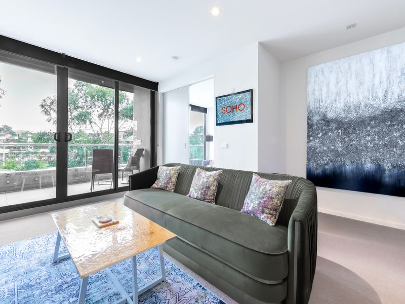 Large windows bring in natural light and frame beautiful outdoor scenery.