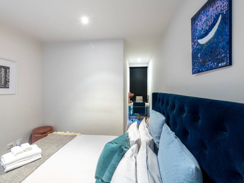 Peaceful bedroom with plush bedding and a calming atmosphere.