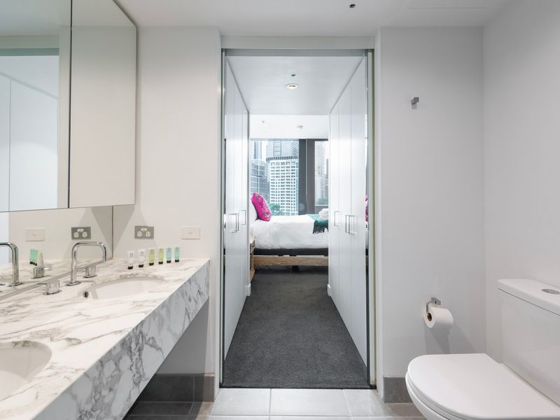 Ensuite bathroom with marble vanity and modern fixtures
