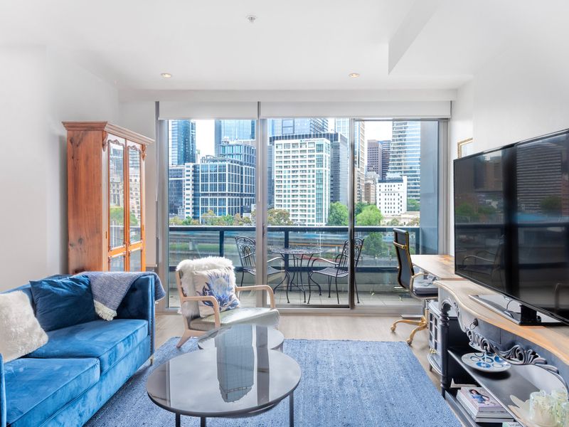 Spacious lounge with city views and direct balcony access