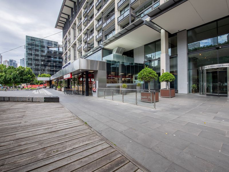 Secure main entrance of the building with potted greenery