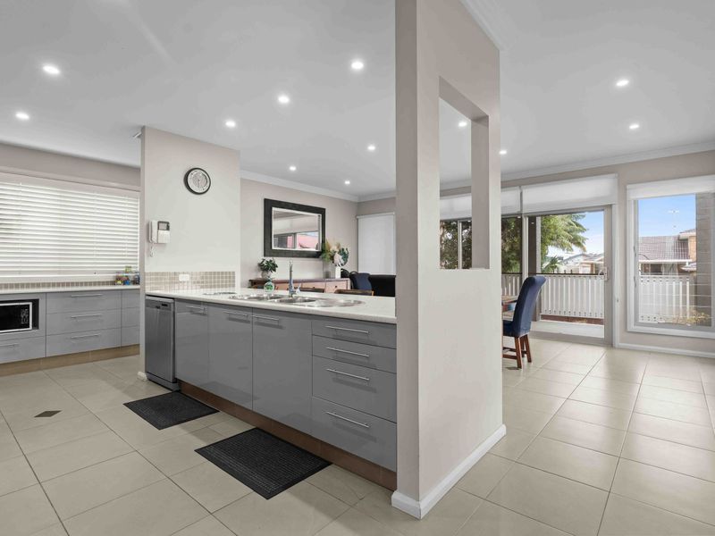 Open-plan kitchen offering a comfortable and functional cooking space