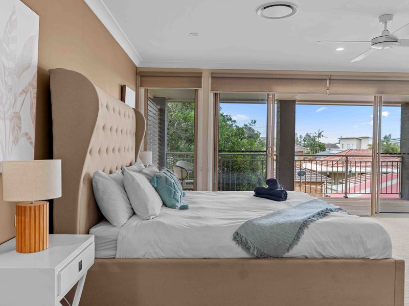 Comfortable, expansive bedroom with a peaceful outdoor terrace