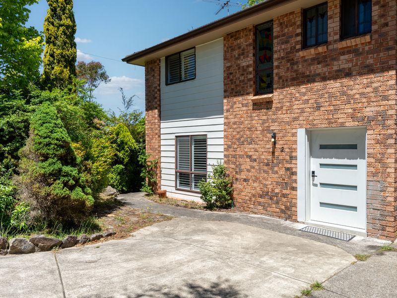 Another view of the home’s front entrance and garden
