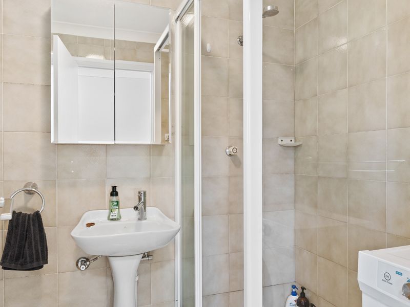 Clean and bright bathroom with walk-in shower