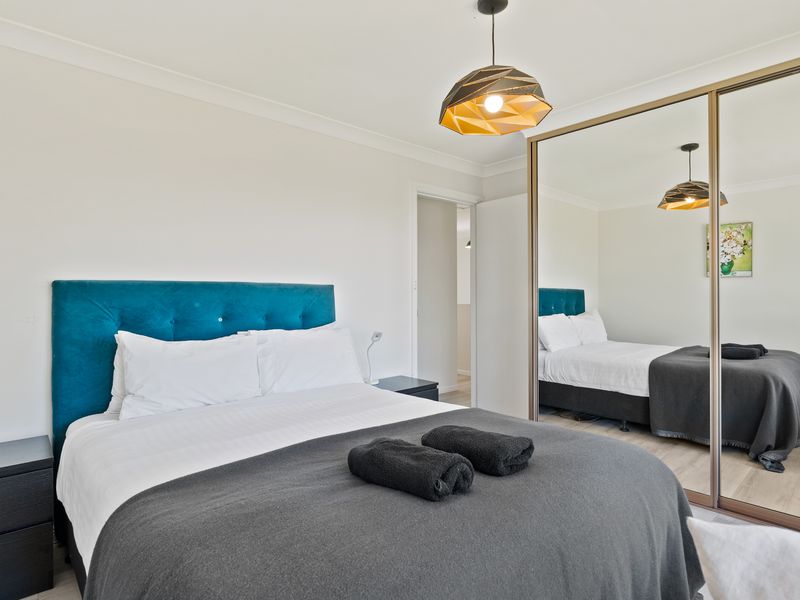 Cozy bedroom with queen bed and modern touches