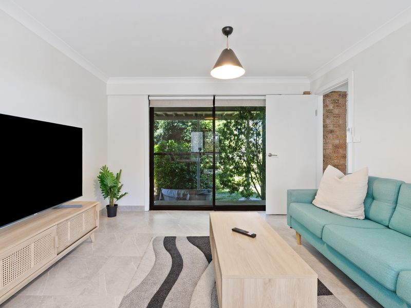 Relaxing lounge area with garden views and a large smart TV