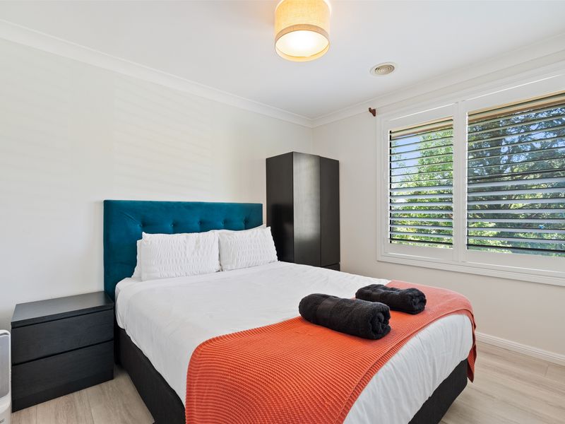 Comfortable queen bedroom with plush bedding