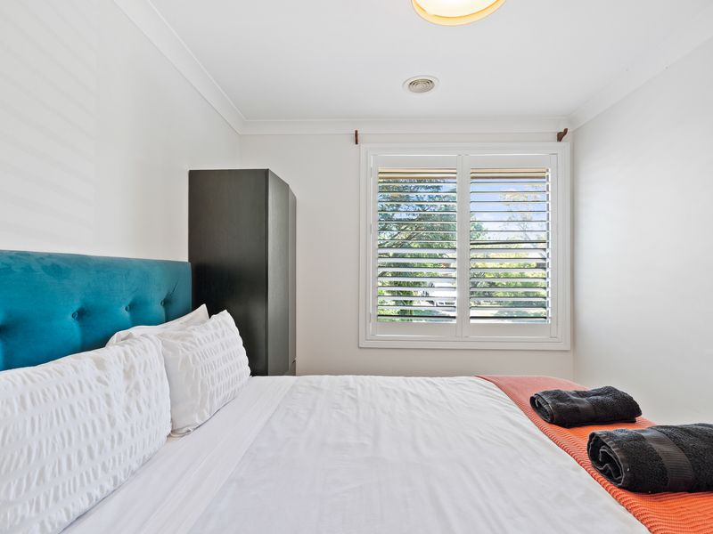 Peaceful bedroom retreat with soft tones and garden views