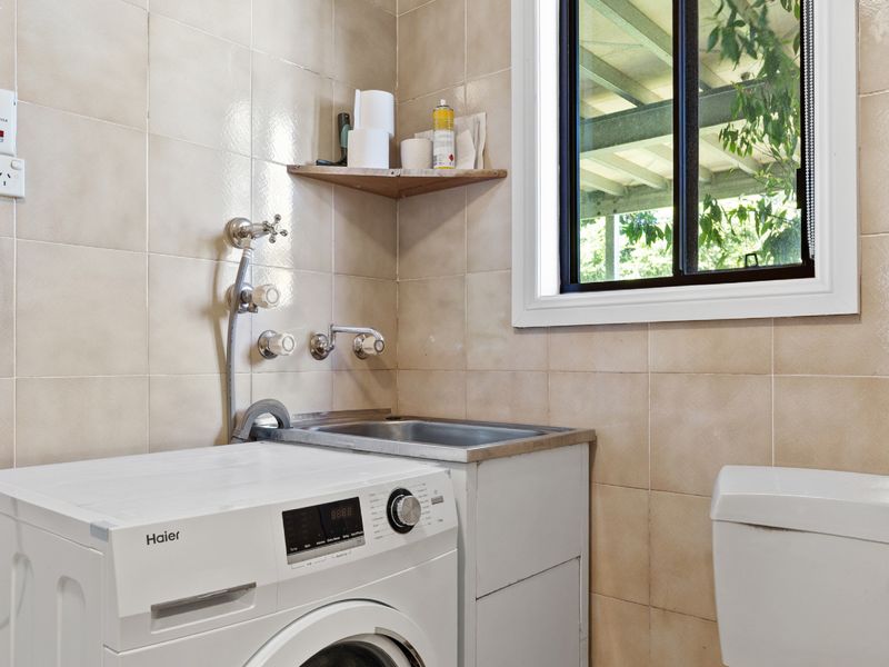 Practical laundry space with washer and utility sink