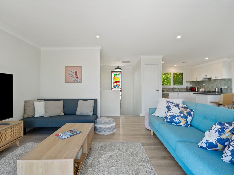 Spacious living zone flowing into the kitchen and dining area