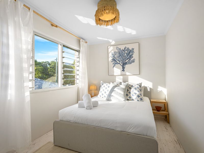 Dreamy bedroom with luxe linens and golden light.