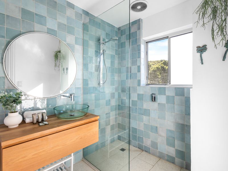 Spa-inspired bathroom with calming coastal tones.