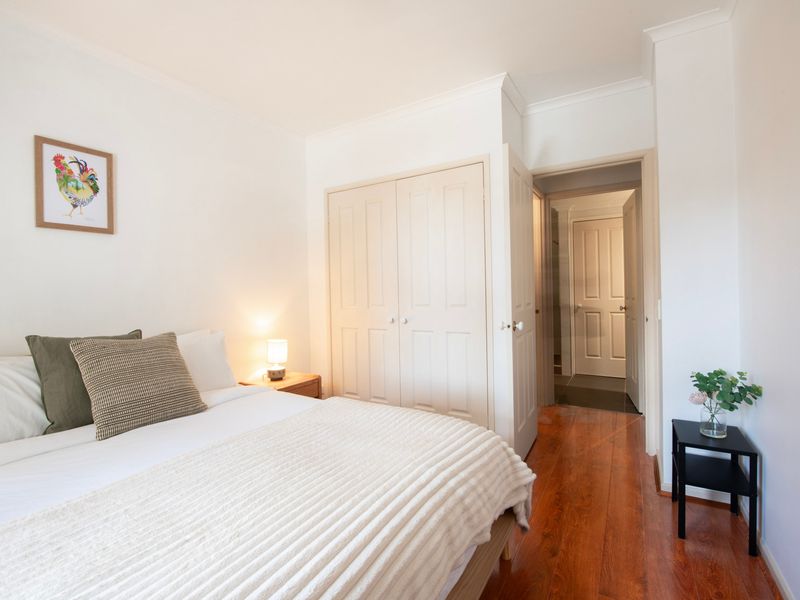 Cozy bedroom nook with a warm, inviting atmosphere and soft lighting, perfect for a restful night's sleep.