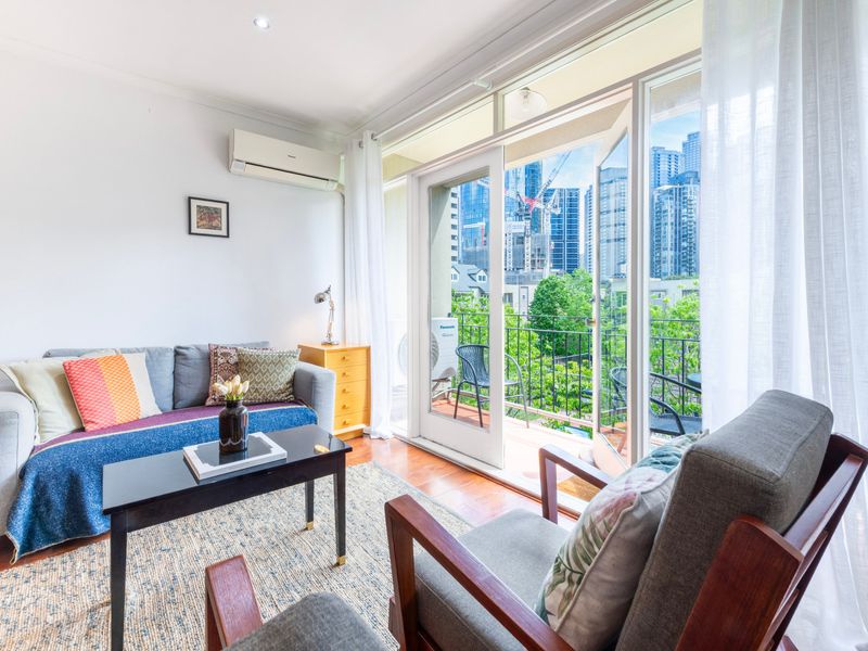 A bright and cozy living space with a modern touch—perfect for relaxing after a day of sightseeing.