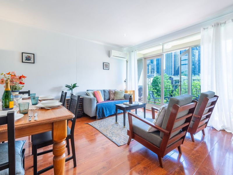 Enjoy this spacious and comfortable living room with large windows for abundant natural light.