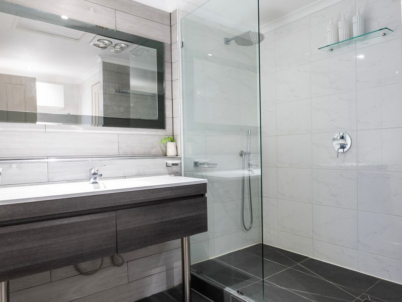 A beautifully designed bathroom with high-end finishes and space to relax.