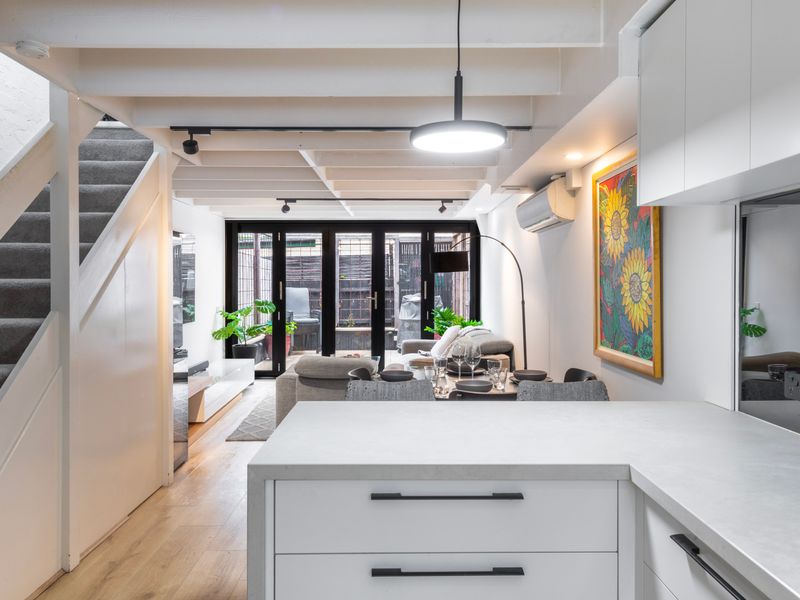 Bright open-plan kitchen with modern finishes and natural light.