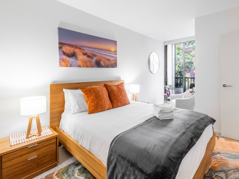 Bright and airy, featuring large windows and soft natural light.