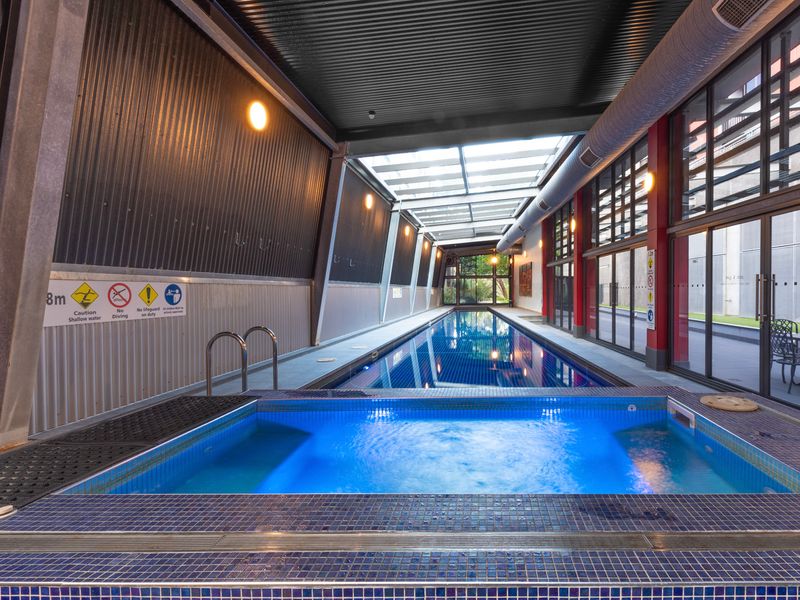 Refreshing pool with skylights and modern design.
