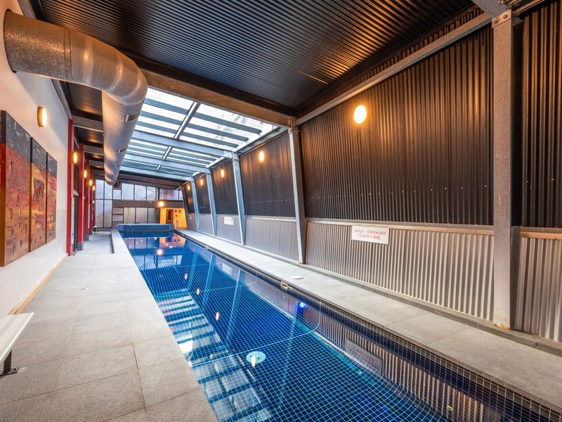 Spacious indoor pool zone perfect for both exercise and relaxation.