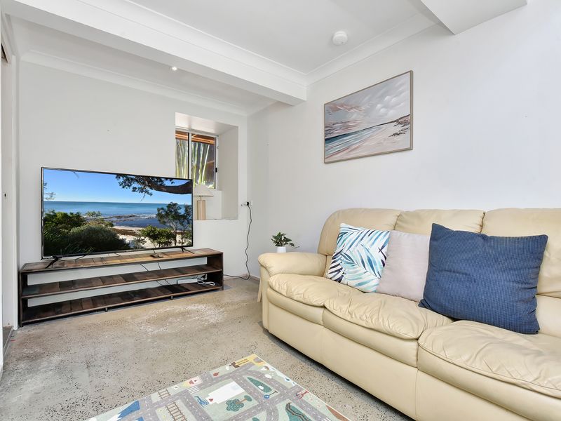 A cosy lounge corner perfect for morning coffees, lazy afternoons, or a quiet moment with a good book.