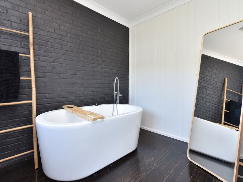 Freestanding tub and soft natural tones.