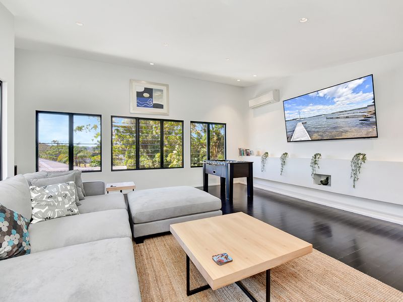 Light-filled lounge with cosy seating and large windows