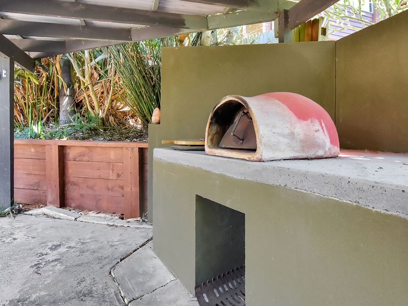 Rustic wood-fired pizza oven for fun outdoor meals
