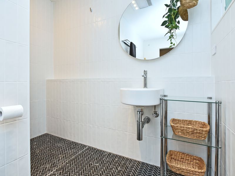 Bright, minimal bathroom with modern fixtures.