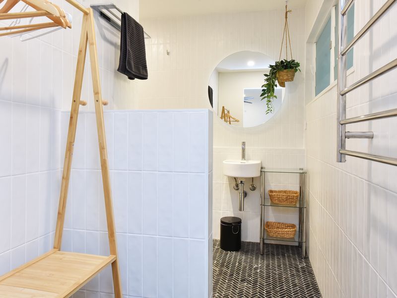 Minimalist bathroom with walk-in shower and natural touches