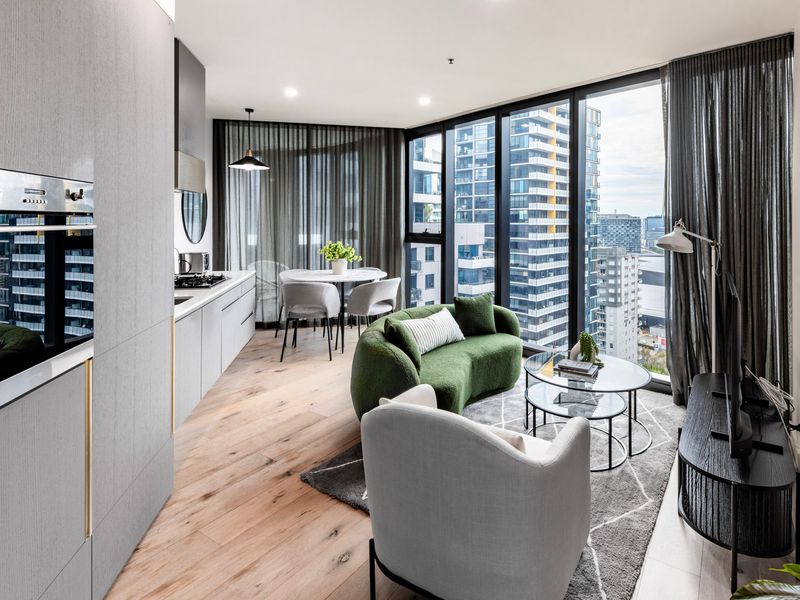 Open-plan living and dining area with modern finishes and skyline outlook.