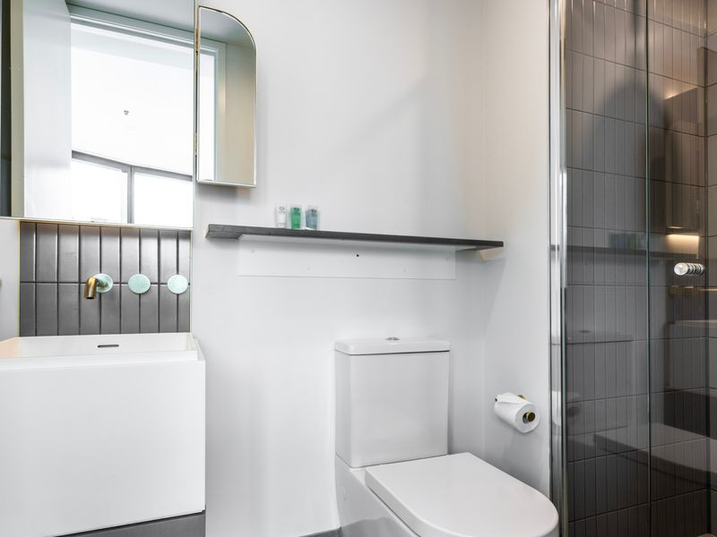 Bright bathroom with modern fittings and spacious vanity.
