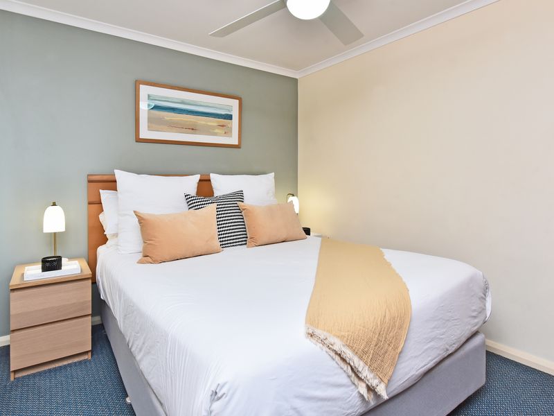 Cozy bedroom with soft lighting and fresh linens