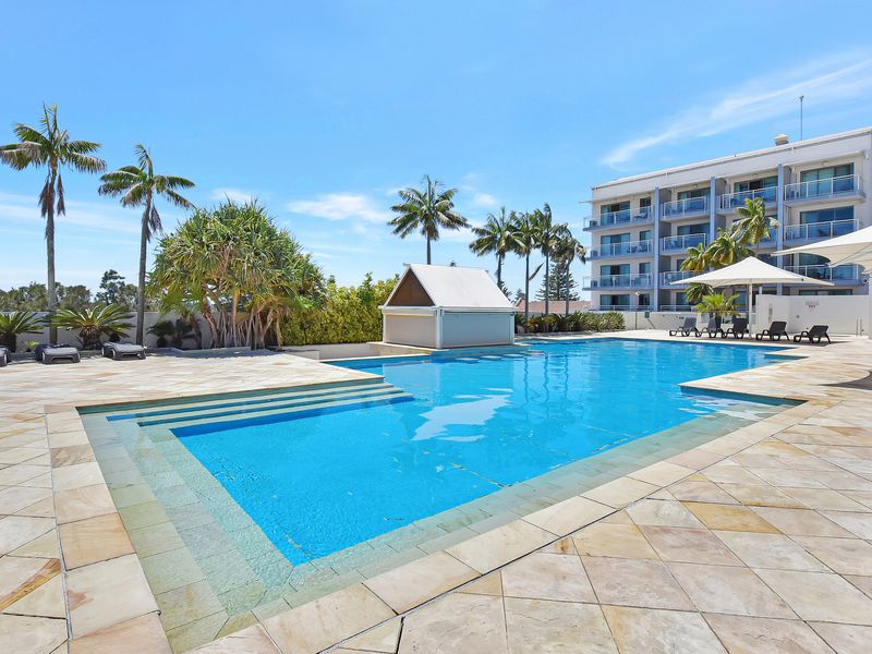 Unwind by the crystal-clear pool surrounded by lush greenery.