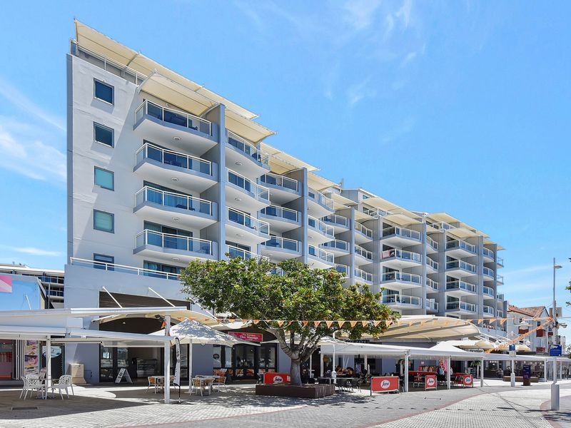 Modern waterfront building with cafés, dining, and shops right at your doorstep.