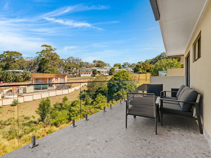 Peaceful balcony seating with leafy outlook