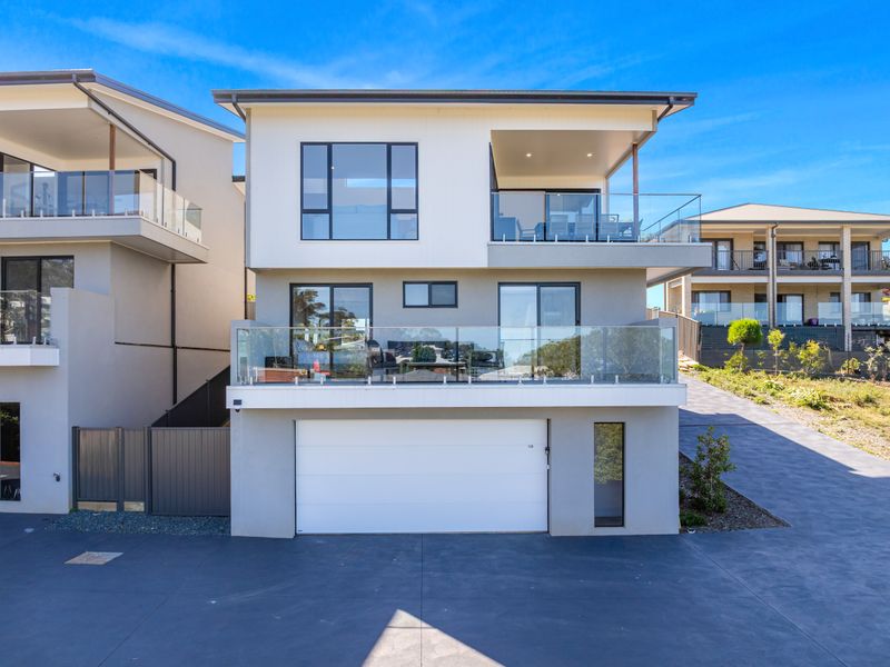 Contemporary facade with sunlit upstairs living