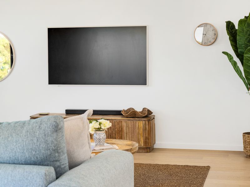 Cozy lounge corner with wall-mounted TV