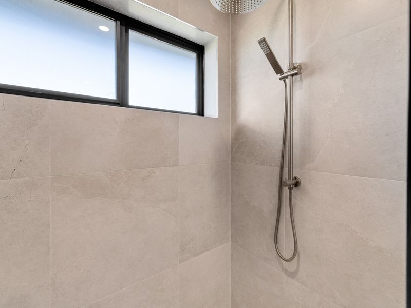 Walk-in shower with contemporary fixtures