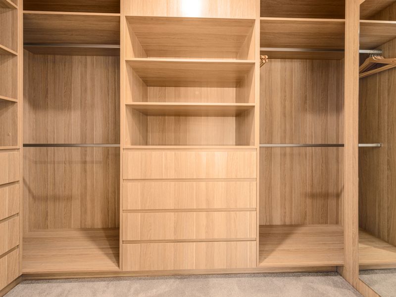 Generous walk-in wardrobe with custom shelving
