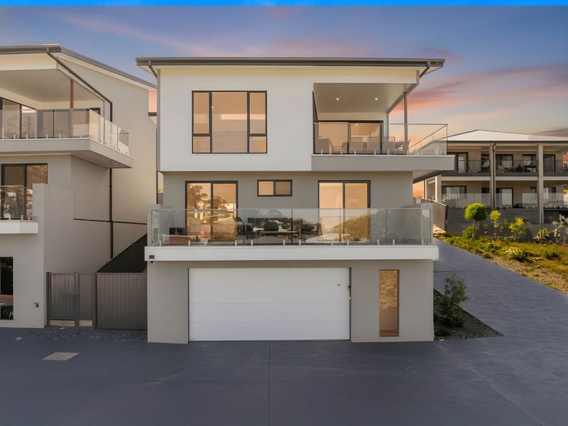 Stylish multi-level exterior with secure garage