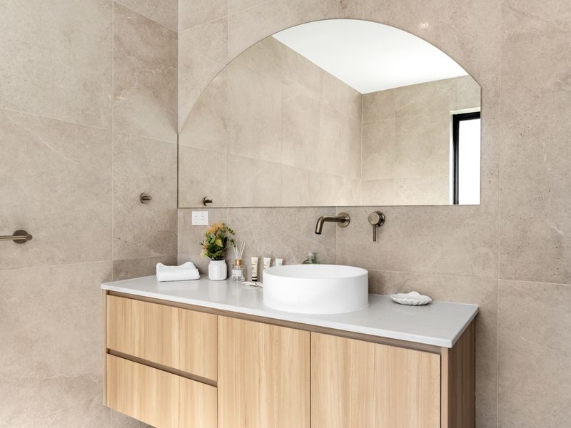 Modern bathroom with double vanity and soft lighting