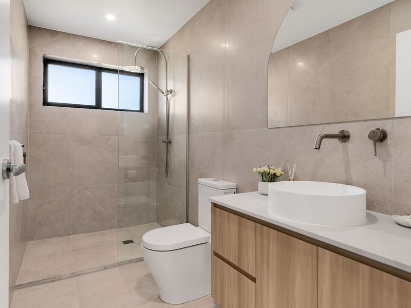 Modern bathroom with sleek vanity and soft lighting