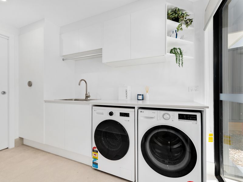 Bright laundry room with washer and dryer