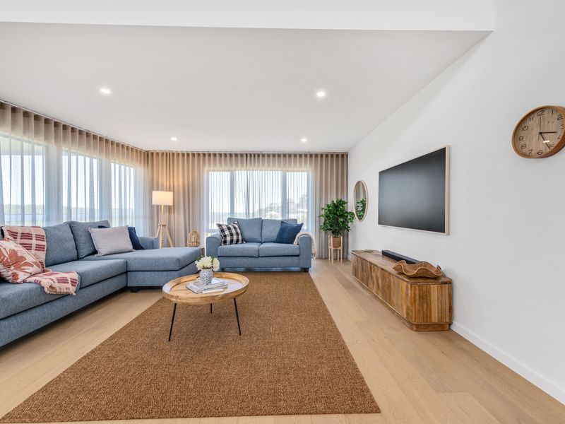 Cozy living area with large TV and comfy sectional