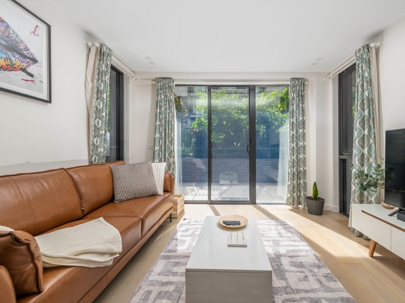 Comfortable lounge area opening directly to the outdoor patio.