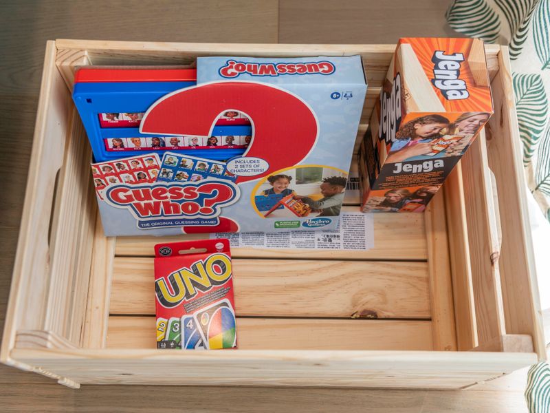 A curated welcome box filled with fun snacks and classic games.