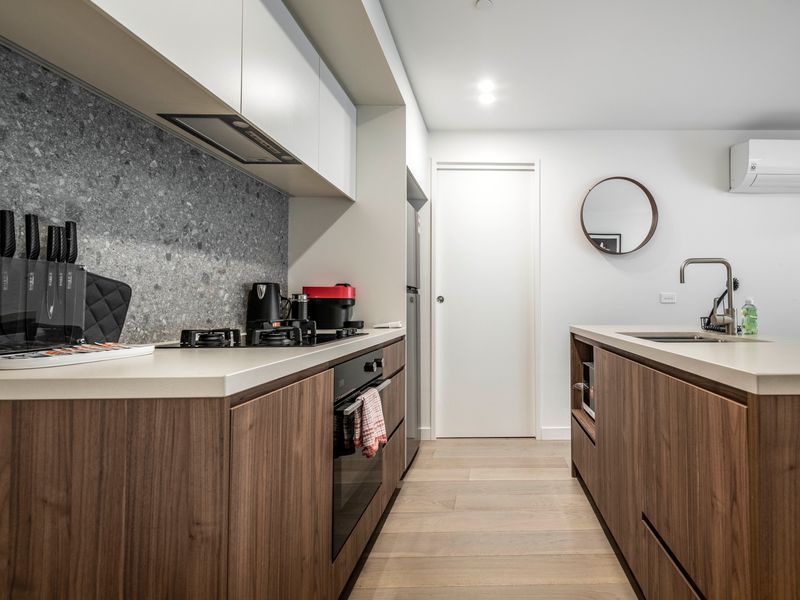 Fully equipped kitchen with sleek appliances and modern finishes.