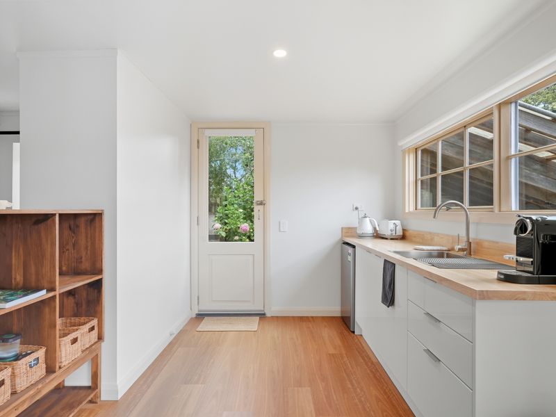 Modern kitchen with direct access to the outdoors.